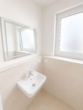 Gäste-WC - Großzügige 2-Zimmer-Erdgeschosswohnung mit Privatgarten, barrierefreiem Zugang und TG-Stellplatz