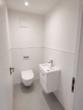 Gäste-WC 1.OG - Exklusives Wohnen auf zwei Ebenen – Maisonettewohnung mit zwei Balkonen und Garage in Bestlage