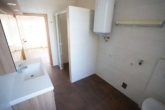 1. OG Badezimmer - Vielseitiges Wohn- und Geschäftshaus in Bestlage