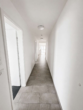 Flur - Moderne 3-Zimmer-Dachgeschosswohnung auf zwei Ebenen mit Kücheninsel, Balkon & 2 Stellplätzen
